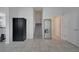 Bright entryway featuring ceramic tile floors, storage cabinet and stairs to the second floor at 2916 Satire St, Kissimmee, FL 34746