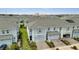 Charming townhomes featuring two-car garages, neat landscaping, and light blue exterior paint at 2916 Satire St, Kissimmee, FL 34746