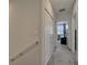 Upstairs hallway with carpeted floor and white doors at 2916 Satire St, Kissimmee, FL 34746