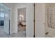 Hallway view showcasing the bedroom and bathroom through the doors in a home at 2916 Satire St, Kissimmee, FL 34746