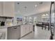 Modern kitchen with stainless steel appliances and an island that overlooks the living area at 2916 Satire St, Kissimmee, FL 34746