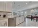 Modern open concept kitchen with stainless steel appliances and white cabinets and countertop at 2916 Satire St, Kissimmee, FL 34746