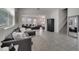 Bright living room with tile flooring, two sofas, and stairs leading to the second floor at 2916 Satire St, Kissimmee, FL 34746