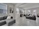 Spacious living room with tile flooring, two sofas, and an open layout at 2916 Satire St, Kissimmee, FL 34746