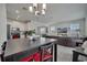 Open concept living space with combined kitchen, dining, and living room areas at 2916 Satire St, Kissimmee, FL 34746