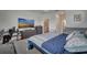 Comfortable primary bedroom featuring a modern TV, dresser, and a baby crib at 2916 Satire St, Kissimmee, FL 34746