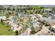 Aerial view of pool area with lazy river, mini golf, palm trees, and lounging areas at 2916 Satire St, Kissimmee, FL 34746