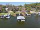 Aerial view of the lake and docks, perfect for enjoying the water at 2929 Lakeshore Dr, Mount Dora, FL 32757