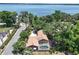 Aerial view of property with a pool and lovely lake view at 2929 Lakeshore Dr, Mount Dora, FL 32757