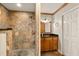 Stylish bathroom featuring tiled walk-in shower, modern vanity, and ample storage space, perfect for relaxation at 2929 Lakeshore Dr, Mount Dora, FL 32757