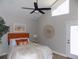Tranquil bedroom with a bright window, a modern ceiling fan, and a comfortable bed at 2929 Lakeshore Dr, Mount Dora, FL 32757