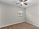 Bedroom with neutral walls, carpet, and a ceiling fan at 2929 Lakeshore Dr, Mount Dora, FL 32757