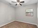 Bedroom with neutral walls, carpet, and a ceiling fan at 2929 Lakeshore Dr, Mount Dora, FL 32757