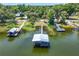 Scenic aerial view of multiple boat docks on the water at 2929 Lakeshore Dr, Mount Dora, FL 32757