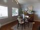 Bright dining room featuring wood floors, natural light, and modern decor for comfortable Gathering meals at 2929 Lakeshore Dr, Mount Dora, FL 32757