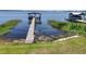 Picturesque lake view with a private dock, offering direct access to the water at 2929 Lakeshore Dr, Mount Dora, FL 32757