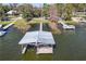 Aerial view of a private dock, offering direct access to the lake for boating and water activities at 2929 Lakeshore Dr, Mount Dora, FL 32757