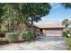 Charming single-Gathering home with a well-manicured yard, a covered porch, and an attached garage at 2929 Lakeshore Dr, Mount Dora, FL 32757