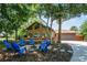 Charming home featuring a lovely front yard with a fire pit and Adirondack chairs at 2929 Lakeshore Dr, Mount Dora, FL 32757