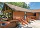 Charming home with a wooden deck, a well-maintained yard and covered porch, ideal for enjoying the outdoors at 2929 Lakeshore Dr, Mount Dora, FL 32757