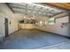 Spacious garage featuring ample storage, high ceilings, and well-maintained floors at 2929 Lakeshore Dr, Mount Dora, FL 32757
