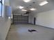 Spacious garage with ample room for vehicles, storage, and other workshop activities at 2929 Lakeshore Dr, Mount Dora, FL 32757