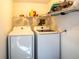 This practical laundry area includes side-by-side washer and dryer units at 2929 Lakeshore Dr, Mount Dora, FL 32757