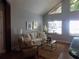 Cozy living room with natural light, neutral tones, and comfortable seating perfect for relaxation and entertaining at 2929 Lakeshore Dr, Mount Dora, FL 32757