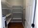 Functional pantry with organized shelving and ample storage space, perfect for keeping essentials tidy and accessible at 2929 Lakeshore Dr, Mount Dora, FL 32757