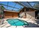 Beautiful screened-in pool area perfect for relaxing and entertaining, with lush surroundings at 2929 Lakeshore Dr, Mount Dora, FL 32757