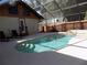 Refreshing screened-in pool with a spa and patio for relaxation in a private, sunny backyard at 2929 Lakeshore Dr, Mount Dora, FL 32757
