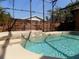 Inviting screened-in pool with clear blue water, tile accents, and a relaxing, private backyard at 2929 Lakeshore Dr, Mount Dora, FL 32757