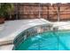 The pool features a waterfall feature with decorative tiles adding to the ambiance at 2929 Lakeshore Dr, Mount Dora, FL 32757