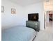 Neutral bedroom features a gray dresser and carpet at 299 Marcello Blvd, Kissimmee, FL 34746