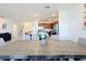 Dining table seating ten with open concept view of stairs and kitchen at 299 Marcello Blvd, Kissimmee, FL 34746
