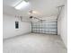 Spacious two car garage featuring an automatic door and plenty of space for vehicles and storage at 299 Marcello Blvd, Kissimmee, FL 34746