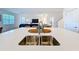 Modern kitchen featuring a double sink, stainless steel faucet, and white countertops at 299 Marcello Blvd, Kissimmee, FL 34746