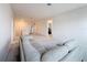 Large living area with plush carpeting, a gray sectional, and an open layout at 299 Marcello Blvd, Kissimmee, FL 34746