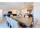 View of dining table, kitchen, and living room in an open concept home at 299 Marcello Blvd, Kissimmee, FL 34746