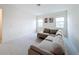 Bright living room boasts a comfortable gray sectional couch and plenty of natural light at 299 Marcello Blvd, Kissimmee, FL 34746
