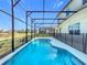 Relax in the sparkling screened-in pool and enjoy the privacy of your backyard oasis at 299 Marcello Blvd, Kissimmee, FL 34746