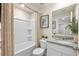 Bright bathroom with a shower-tub combo featuring granite countertops, white cabinets, and modern fixtures at 300 Preston Cove Dr, St Cloud, FL 34771