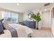 Bedroom featuring a large window, a decorative dresser and a king-size bed at 300 Preston Cove Dr, St Cloud, FL 34771