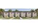 A new construction townhouse complex featuring a neatly manicured lawn and modern design at 300 Preston Cove Dr, St Cloud, FL 34771