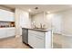 Kitchen island featuring modern white cabinets, granite countertops, and a stainless steel dishwasher at 300 Preston Cove Dr, St Cloud, FL 34771