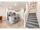 Modern kitchen featuring stainless steel appliances, tile flooring, and a breakfast bar with seating at 300 Preston Cove Dr, St Cloud, FL 34771