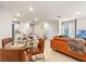Open-concept living space with kitchen, dining area, and living room for easy entertaining at 300 Preston Cove Dr, St Cloud, FL 34771