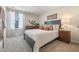 Comfortable main bedroom showcasing a well-dressed bed, modern decor, and a tranquil atmosphere at 300 Preston Cove Dr, St Cloud, FL 34771