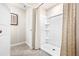 Bright bathroom highlighting a clean, white shower stall with built-in shelving, paired with a neutral shower curtain at 300 Preston Cove Dr, St Cloud, FL 34771