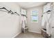 Walk-in closet with custom organizers, City Studio storage bags, and a window offering plenty of natural light at 300 Preston Cove Dr, St Cloud, FL 34771